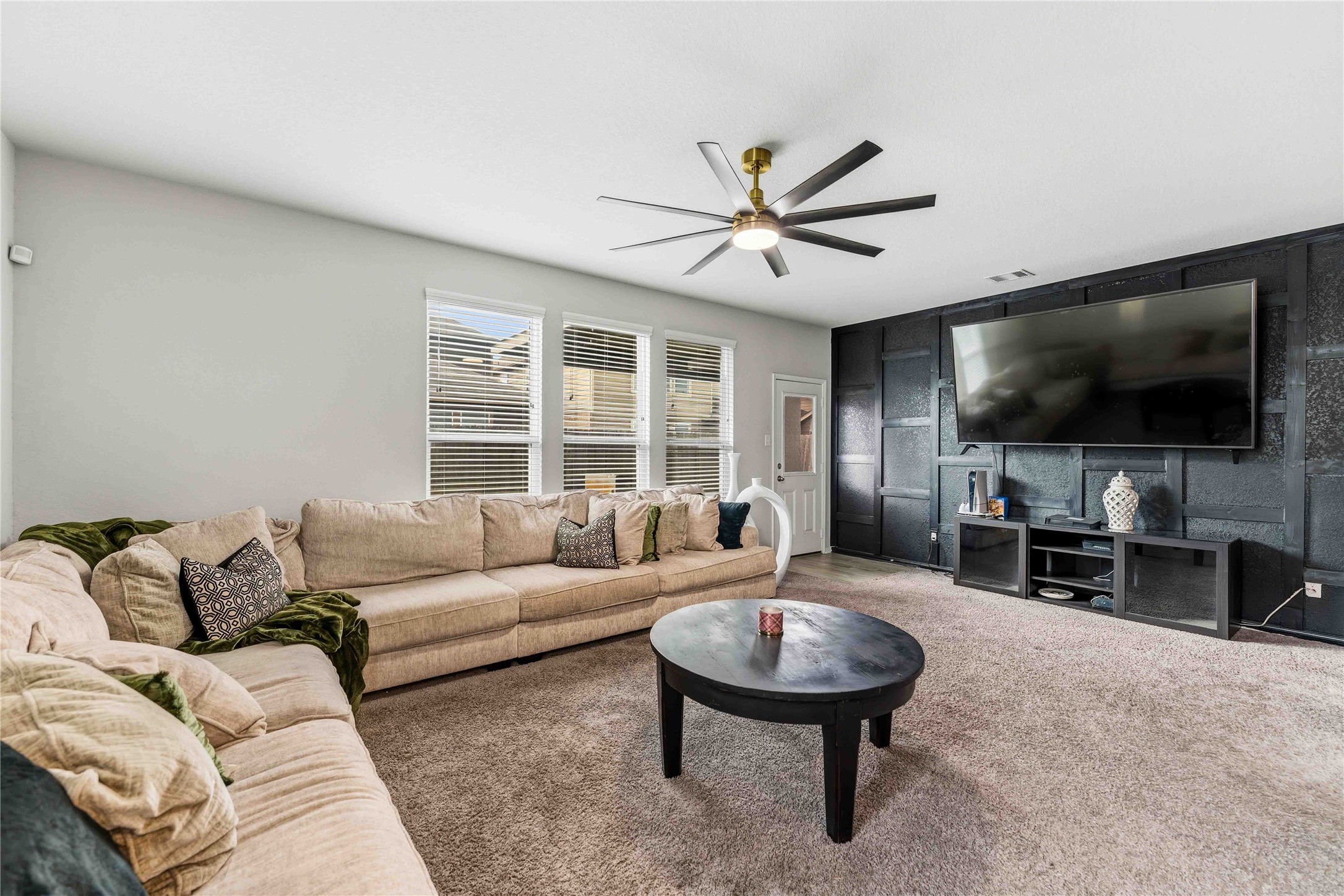 14810 Ruddy Duck Lane Houston, TX 77049 - Photo 9 of 28 a living room with furniture and a flat screen tv