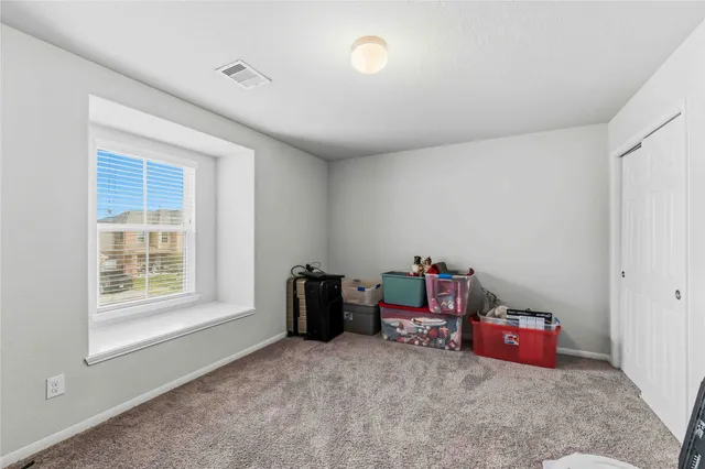a living room with hard wood floors and a window