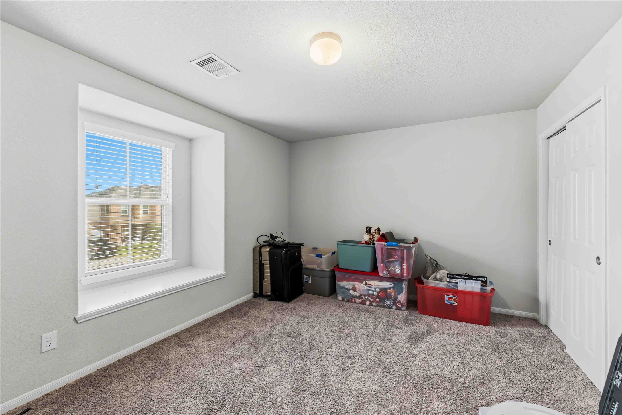 14810 Ruddy Duck Lane Houston, TX 77049 - Photo 10 of 28 a living room with hard wood floors and a window