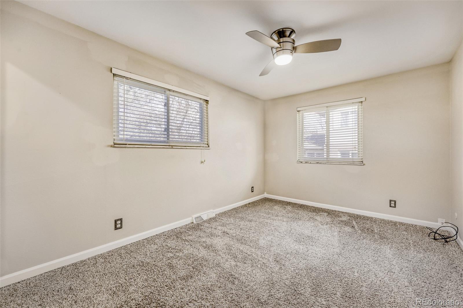 9787 Lane Street Thornton, CO 80260 - Photo 13 of 29 a view of an empty room with a window