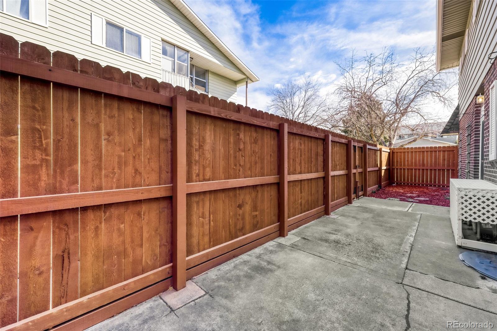9787 Lane Street Thornton, CO 80260 - Photo 24 of 29 a view of a backyard