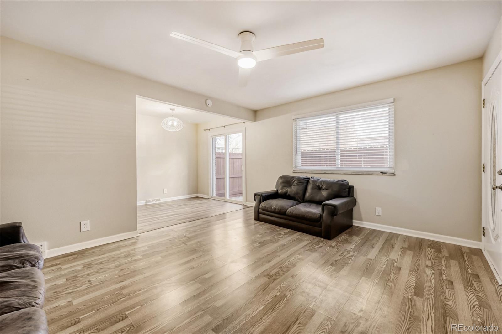 9787 Lane Street Thornton, CO 80260 - Photo 4 of 29 a living room with furniture and a window