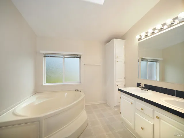 a bathroom with a bathtub and a sink
