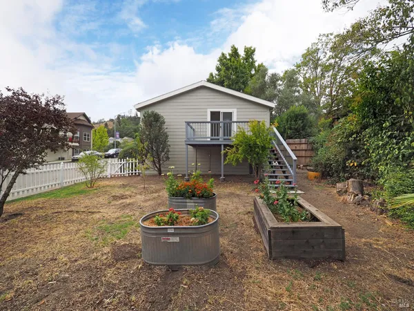 a front view of house with yard and seating