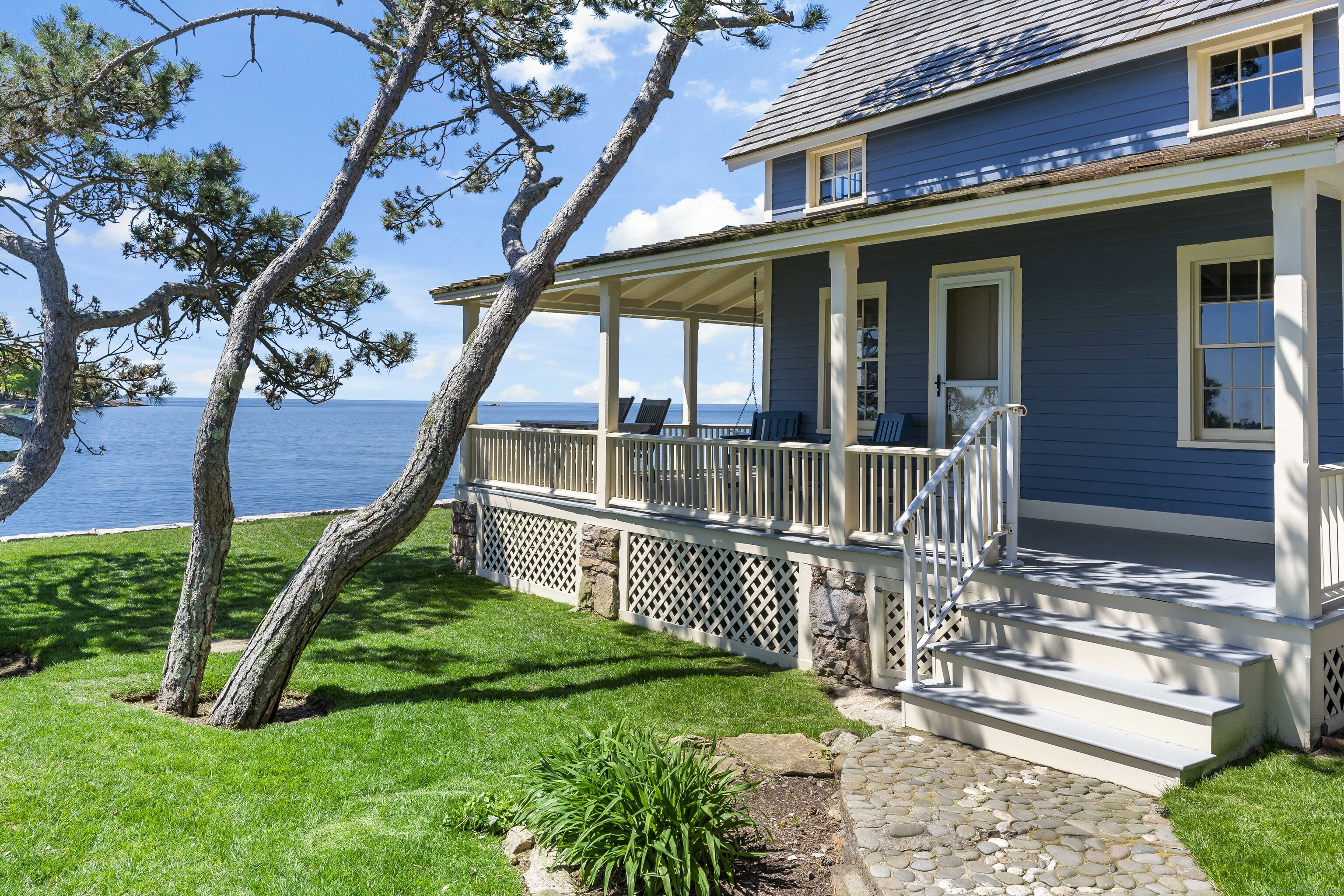 Belden Island Branford, CT 06405 - Photo 19 of 40 a front view of a house with a yard