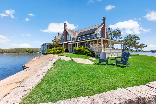a view of swimming pool with outdoor seating and city view