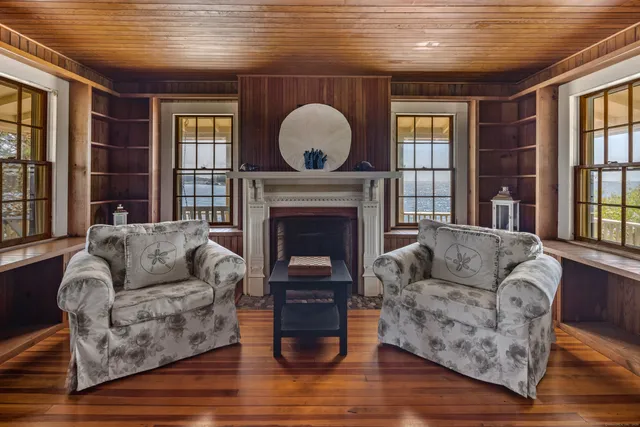 a living room with furniture or stairs and a wooden floor