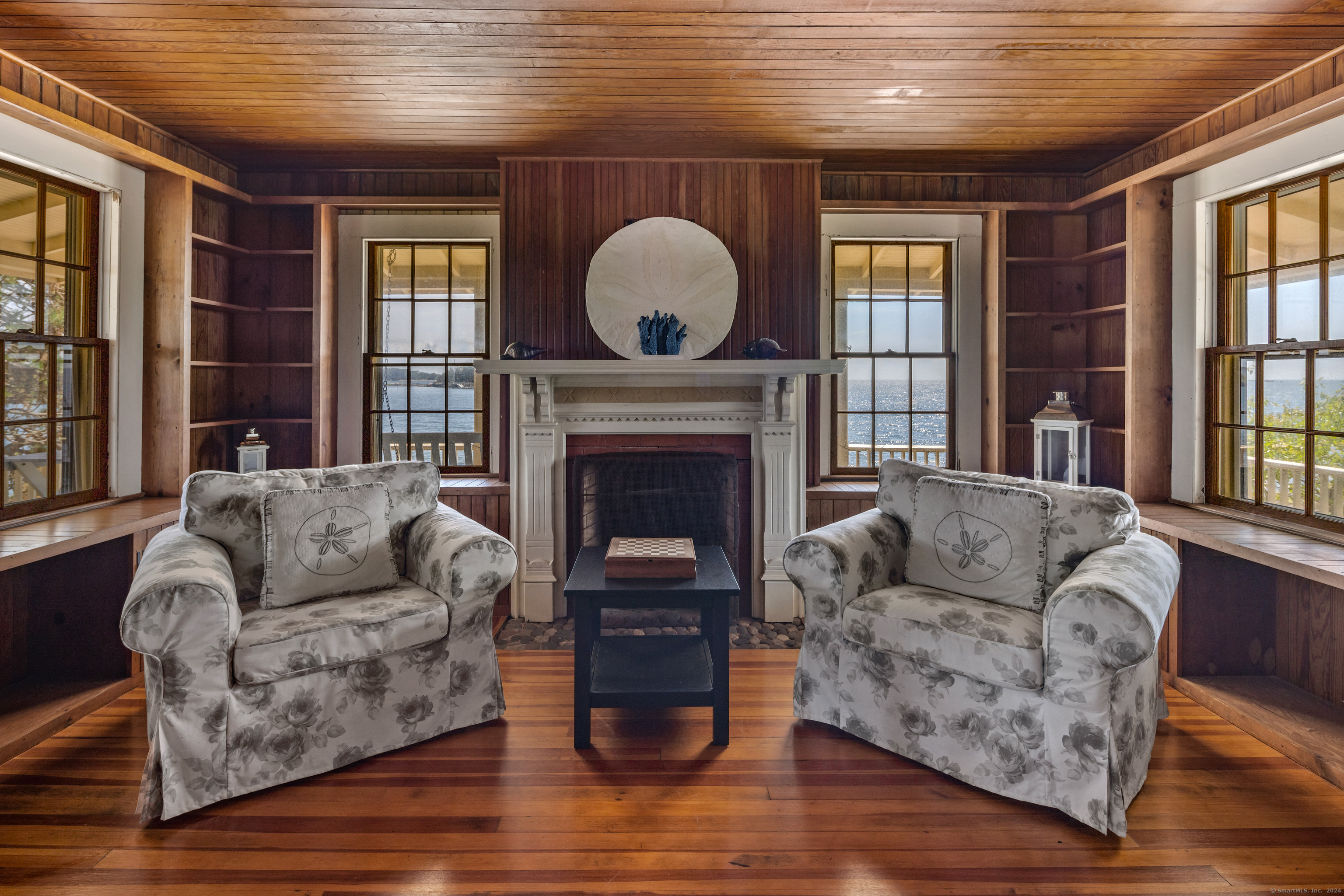 Belden Island Branford, CT 06405 - Photo 31 of 40 a living room with furniture and a fireplace