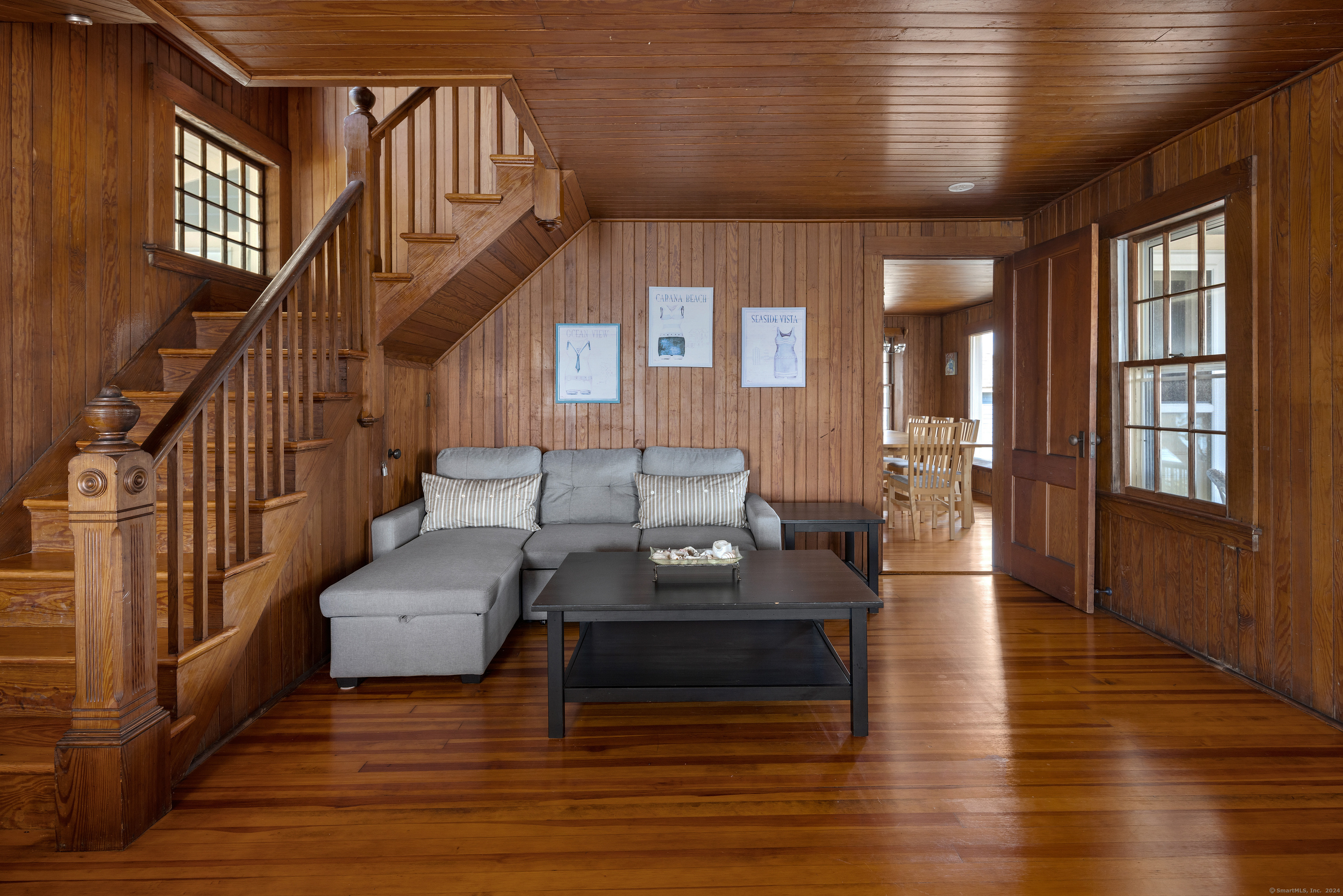 Belden Island Branford, CT 06405 - Photo 32 of 40 a living room with furniture or stairs and a wooden floor