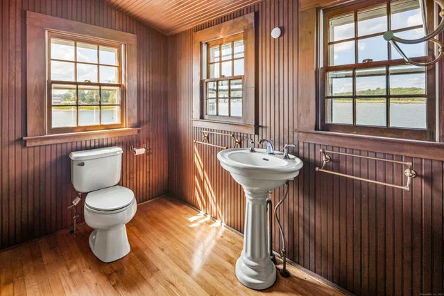 a view of wooden floor in a hall with wooden floor