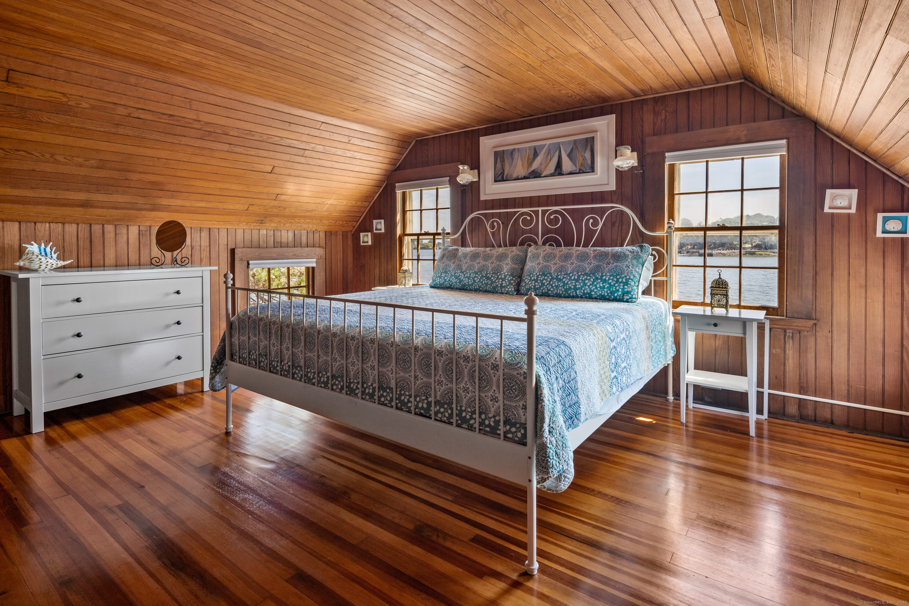 Belden Island Branford, CT 06405 - Photo 35 of 40 a bedroom with a bed and a wooden floor