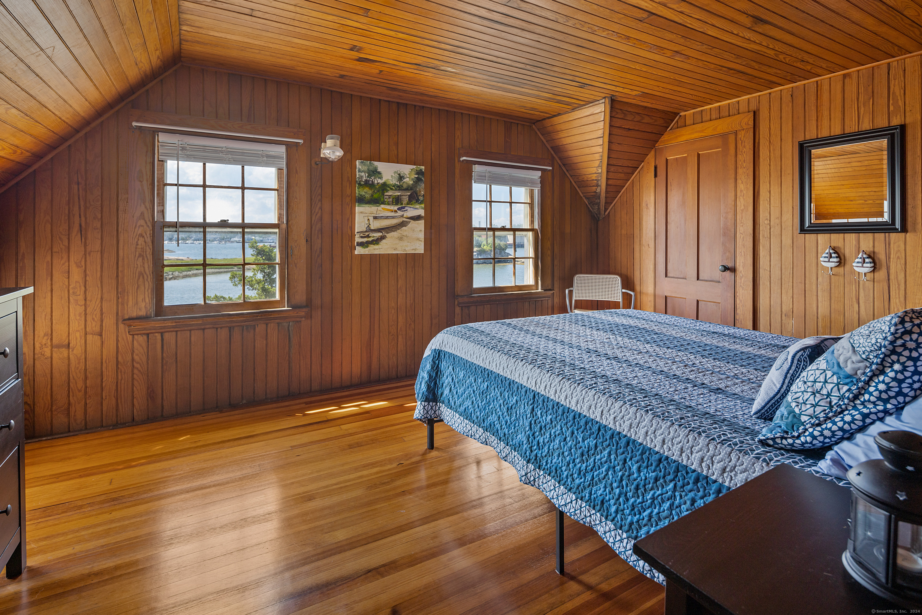 Belden Island Branford, CT 06405 - Photo 37 of 40 a bedroom with a bed and wooden floor