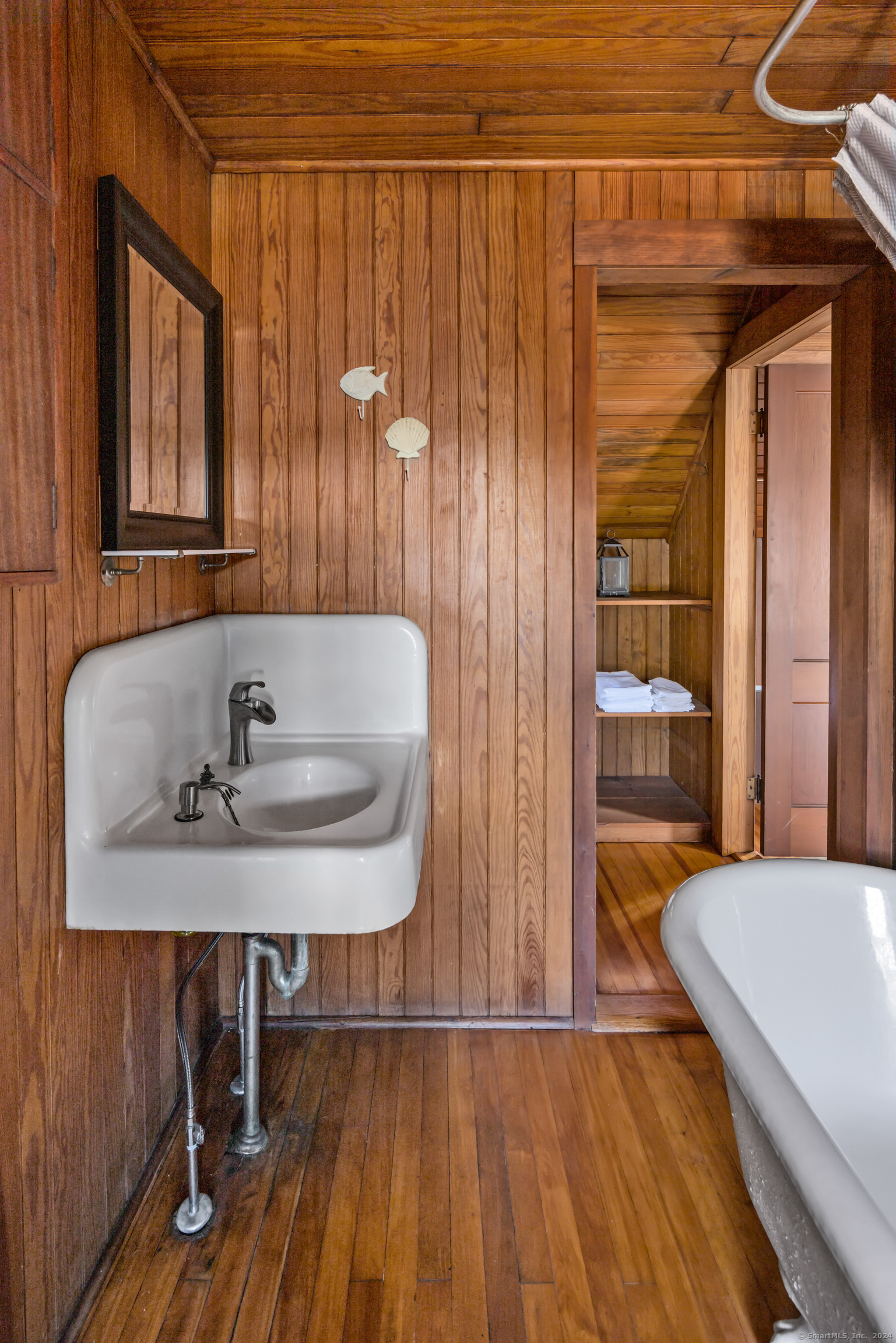 Belden Island Branford, CT 06405 - Photo 38 of 40 a bathroom with a sink and a mirror