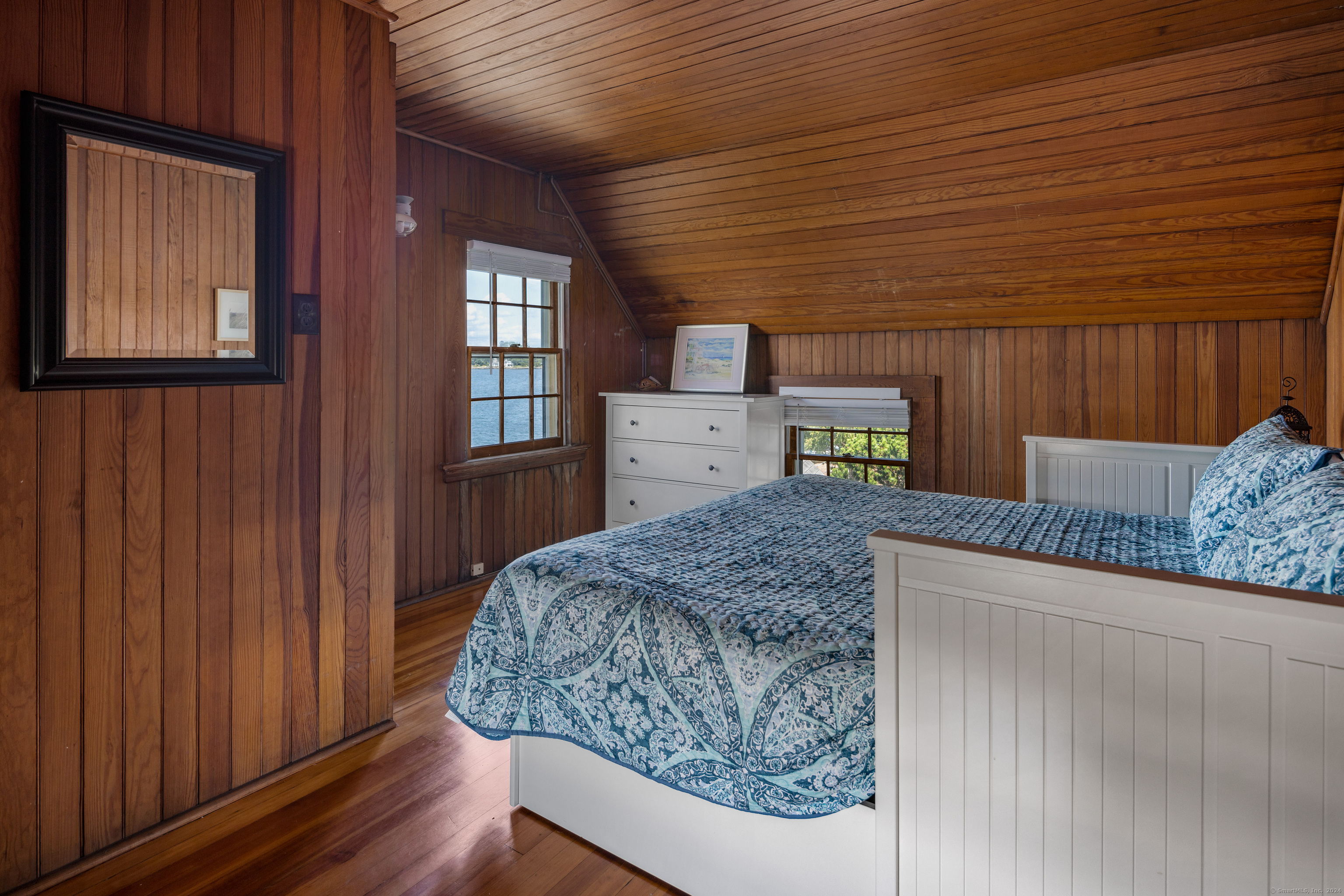 Belden Island Branford, CT 06405 - Photo 39 of 40 a bedroom with a bed and wooden floor