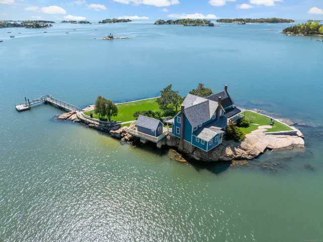 a small pool with lawn chairs