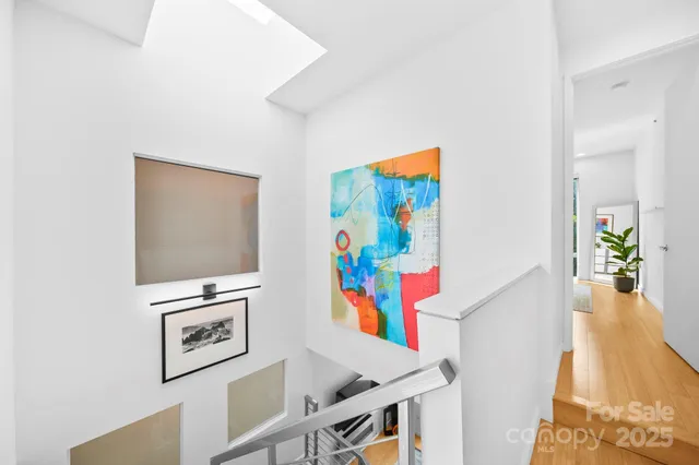 a view of a hallway with furniture and toys