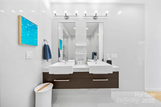 a bathroom with a sink a mirror and a toilet