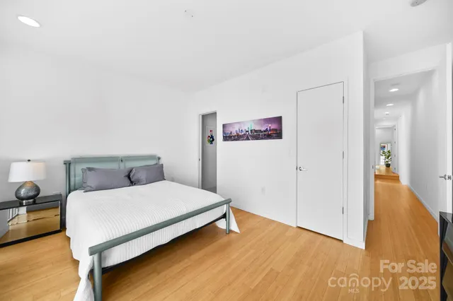 a bedroom with a bed and a table