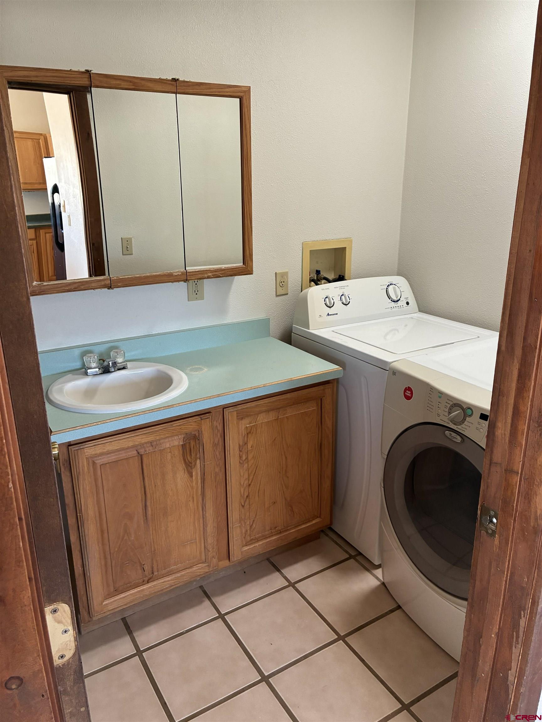 4491 2300th Road Delta, CO 81416 - Photo 7 of 25 a utility room with dryer and washer