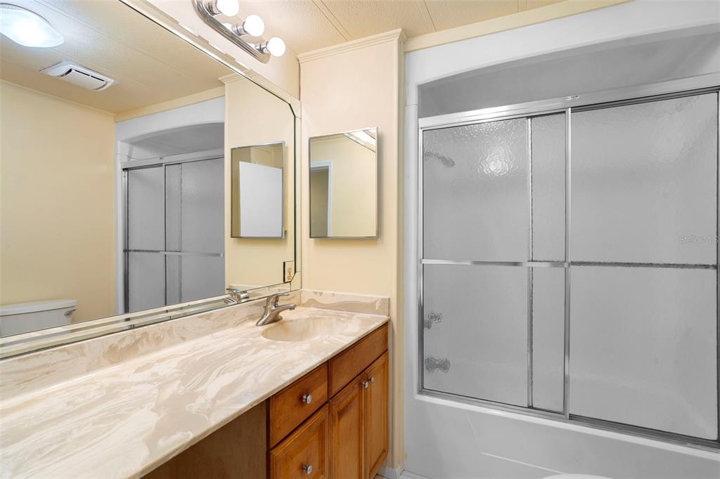 105 Florence Boulevard DeBary, FL 32713 - Photo 15 of 31 a bathroom with a granite countertop sink mirror and double