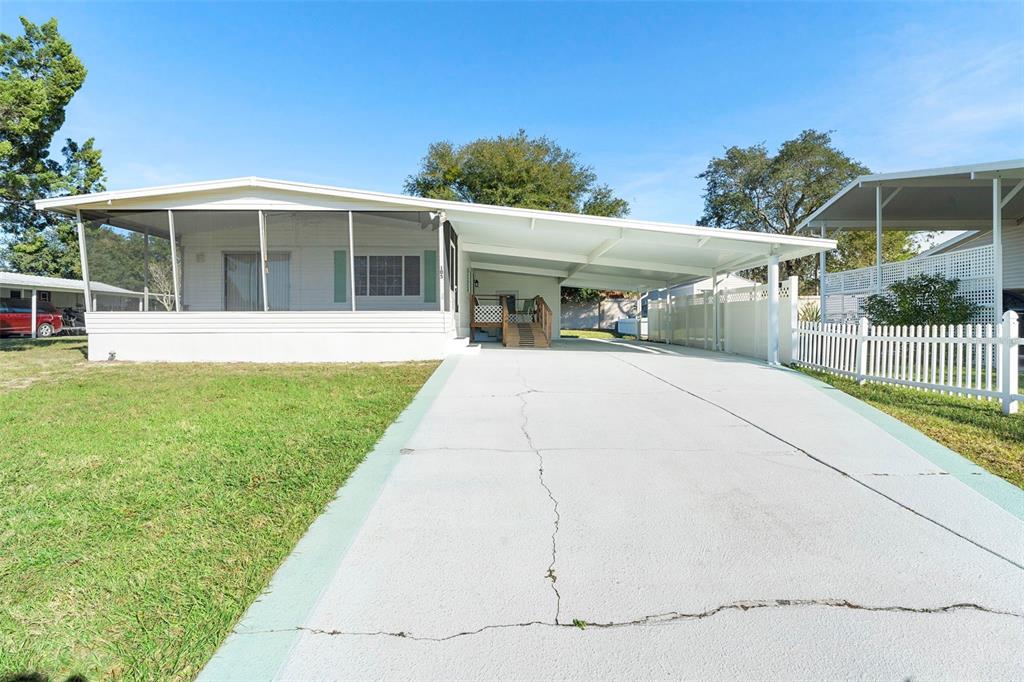 105 Florence Boulevard DeBary, FL 32713 - Photo 2 of 31 a house view with a garden space