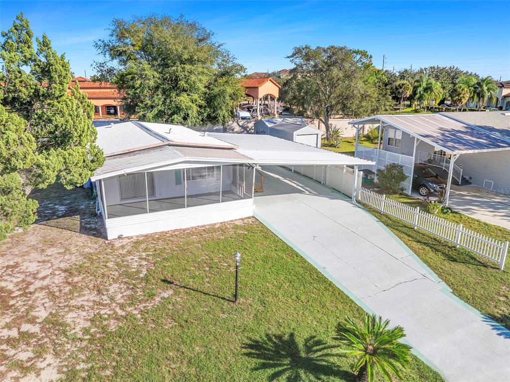 105 Florence Boulevard DeBary, FL 32713 - Photo 25 of 31 a view of a swimming pool with an outdoor seating and a yard