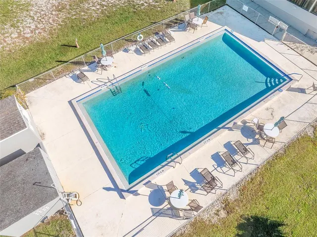 a view of a pool with a yard