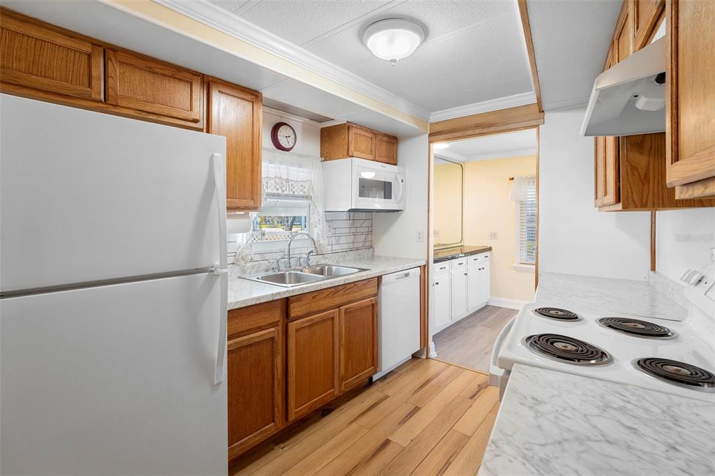 105 Florence Boulevard DeBary, FL 32713 - Photo 4 of 31 a kitchen with stainless steel appliances a stove a sink and a refrigerator