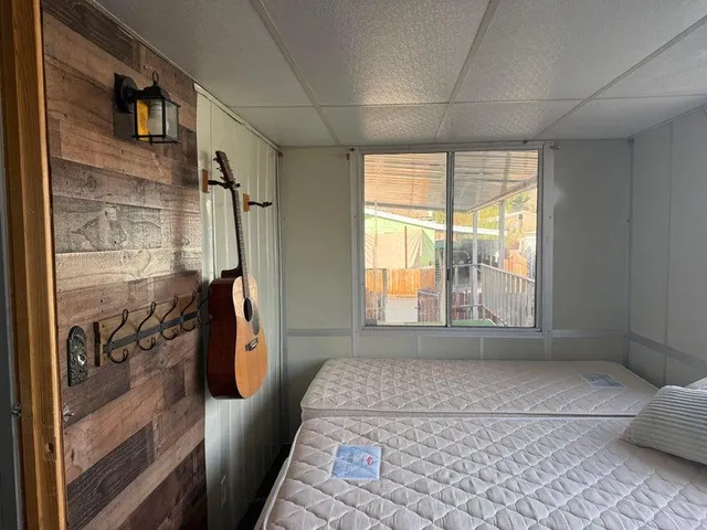 a bathroom with a granite countertop shower and a tub