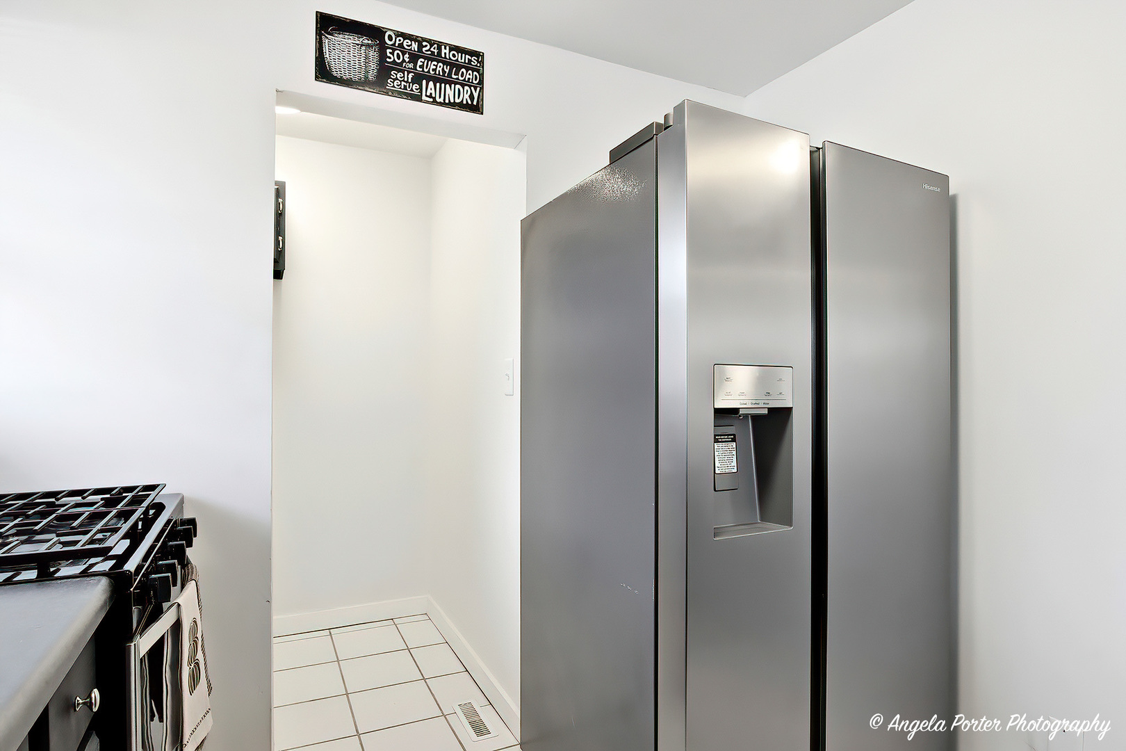 24676 West Clinton Avenue Round Lake, IL 60073 - Photo 11 of 28 a view of a refrigerator in kitchen and an empty room