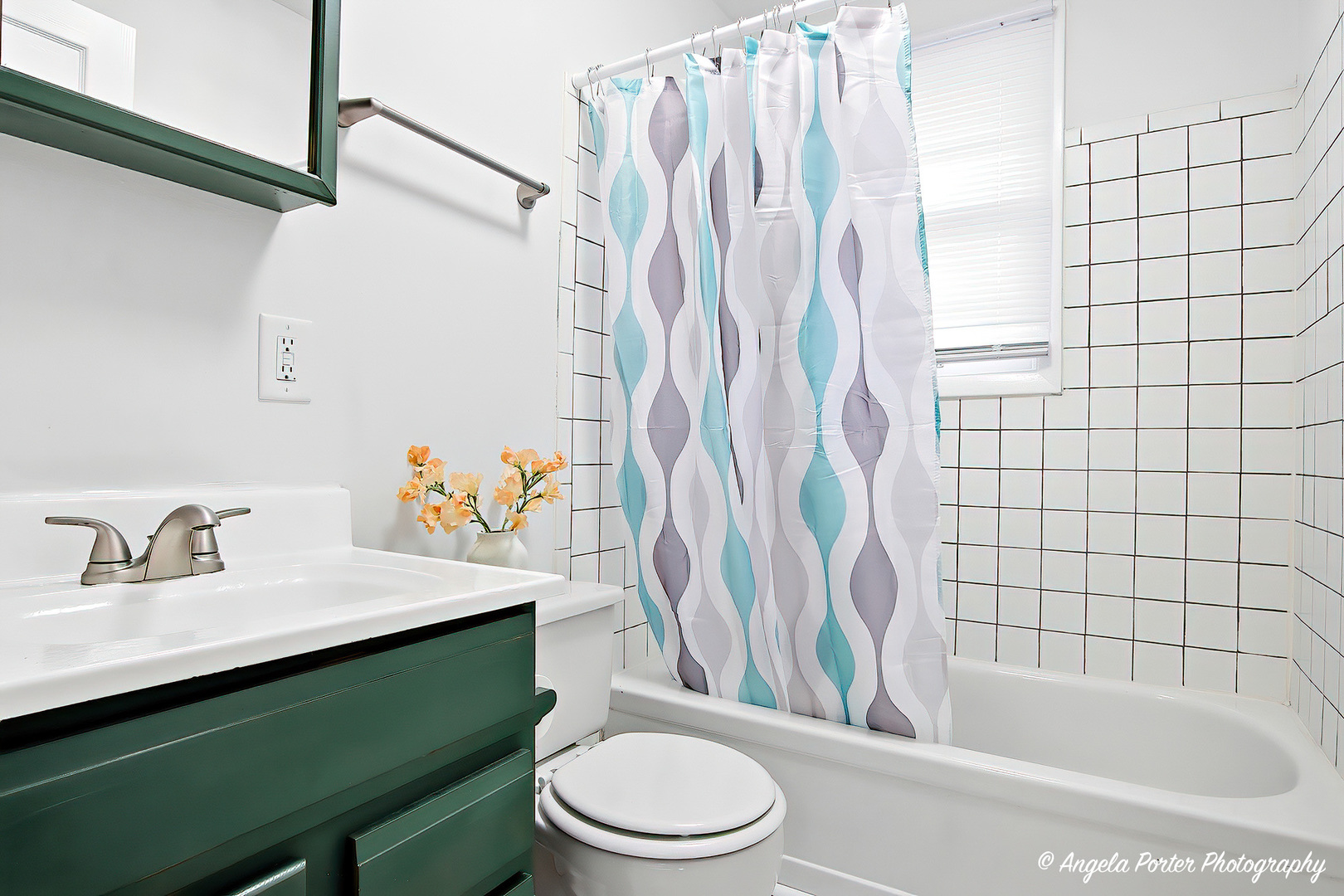24676 West Clinton Avenue Round Lake, IL 60073 - Photo 14 of 28 a bathroom with a sink toilet and shower