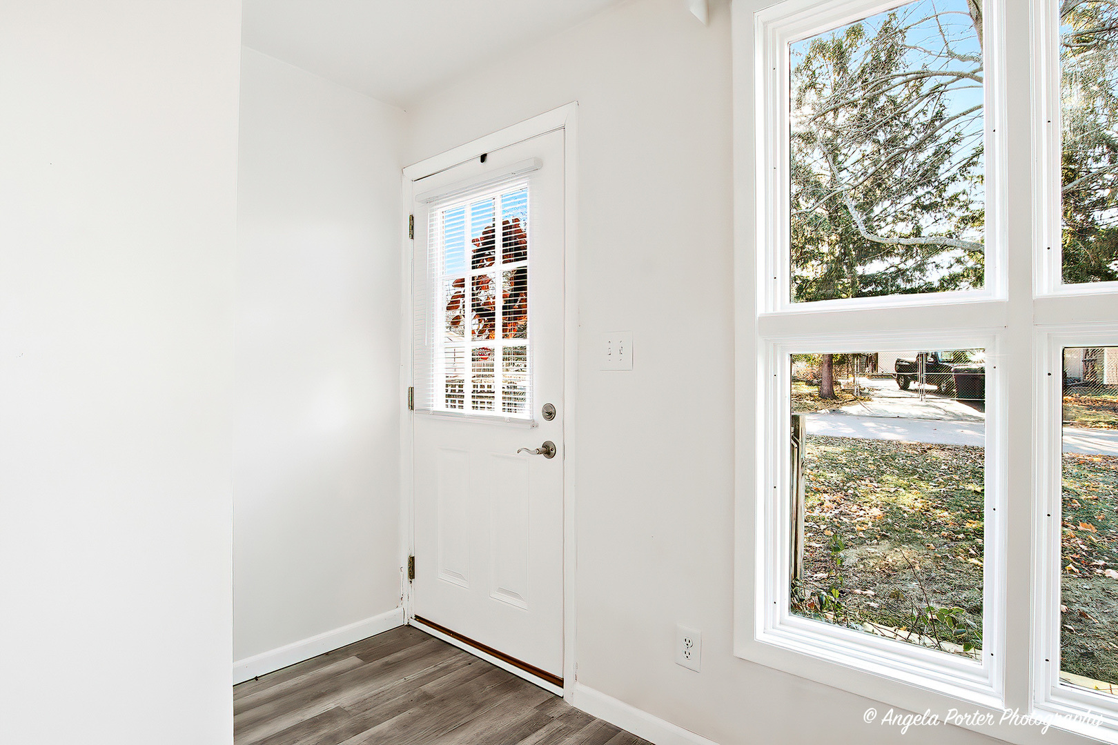 24676 West Clinton Avenue Round Lake, IL 60073 - Photo 5 of 28 a view of a room with wooden floor and windows