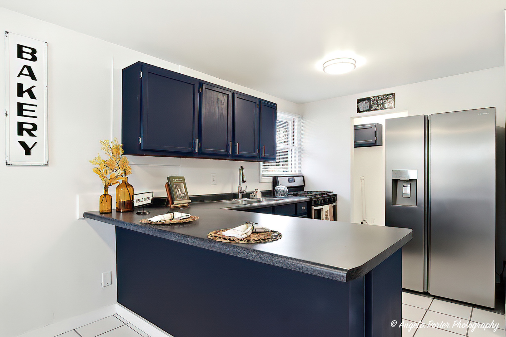 24676 West Clinton Avenue Round Lake, IL 60073 - Photo 6 of 28 a kitchen with a sink a refrigerator and cabinets