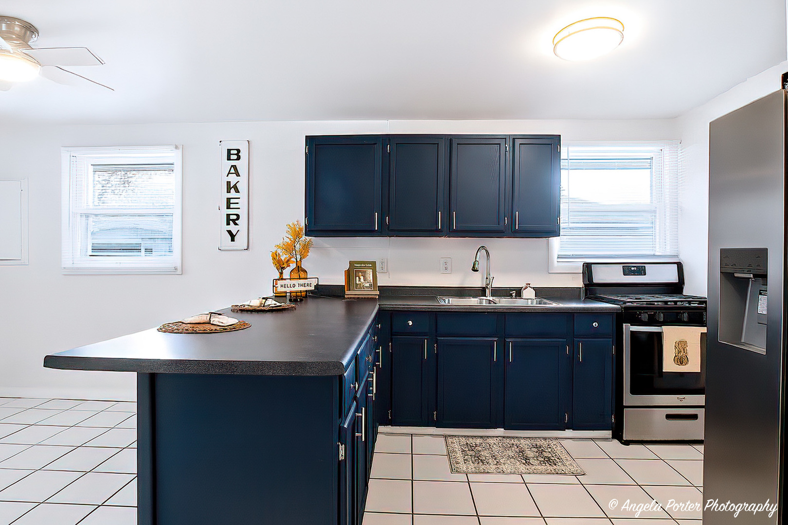 24676 West Clinton Avenue Round Lake, IL 60073 - Photo 7 of 28 a kitchen with a sink stove and microwave