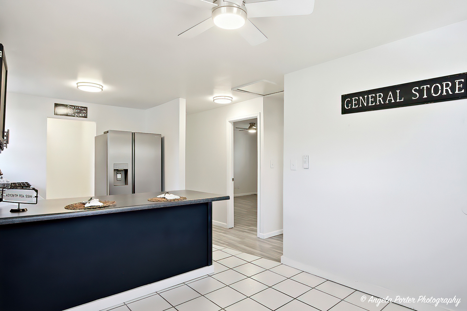 24676 West Clinton Avenue Round Lake, IL 60073 - Photo 9 of 28 a bathroom with a sink a mirror and a shower