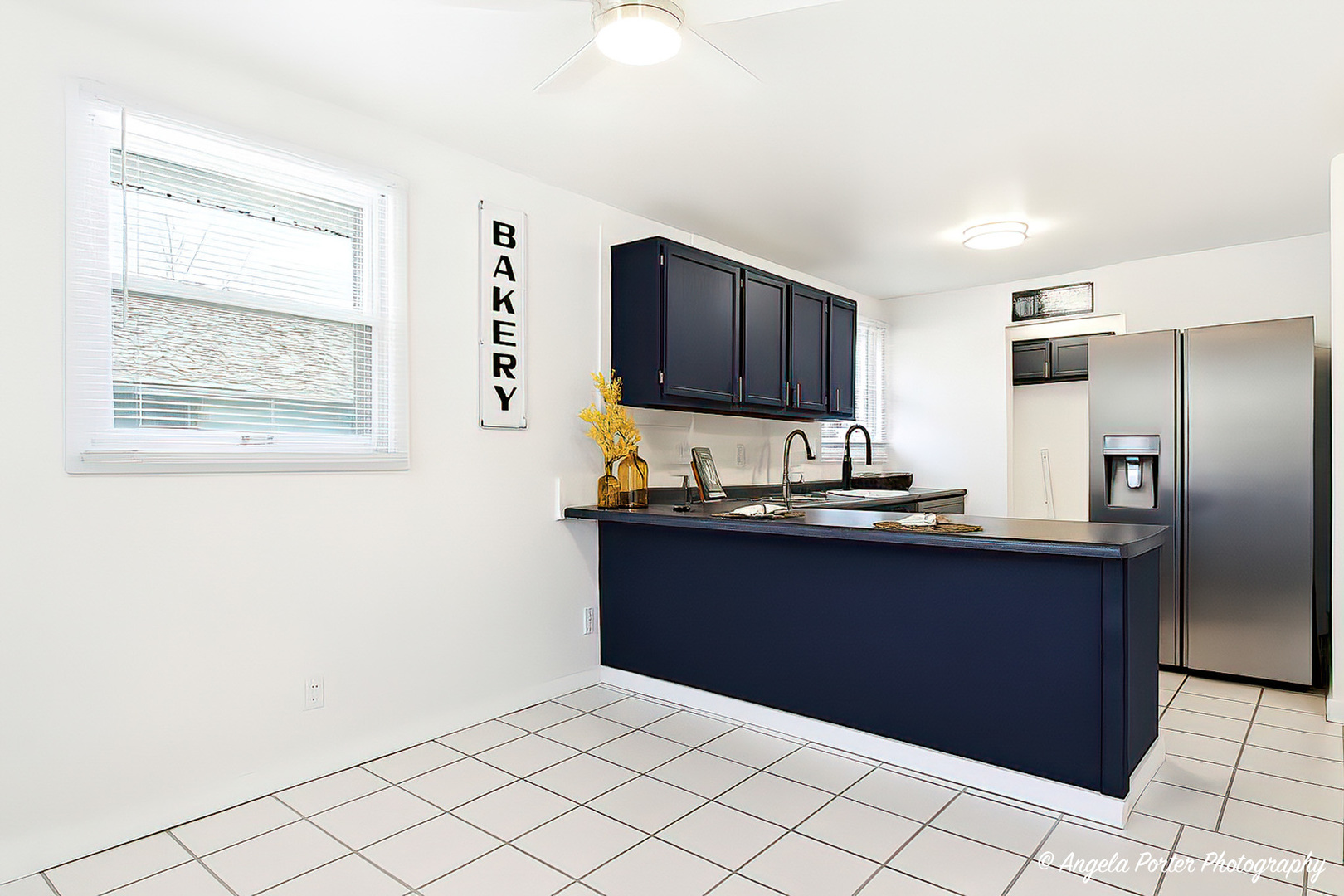 24676 West Clinton Avenue Round Lake, IL 60073 - Photo 10 of 28 a kitchen with granite countertop a refrigerator and a sink
