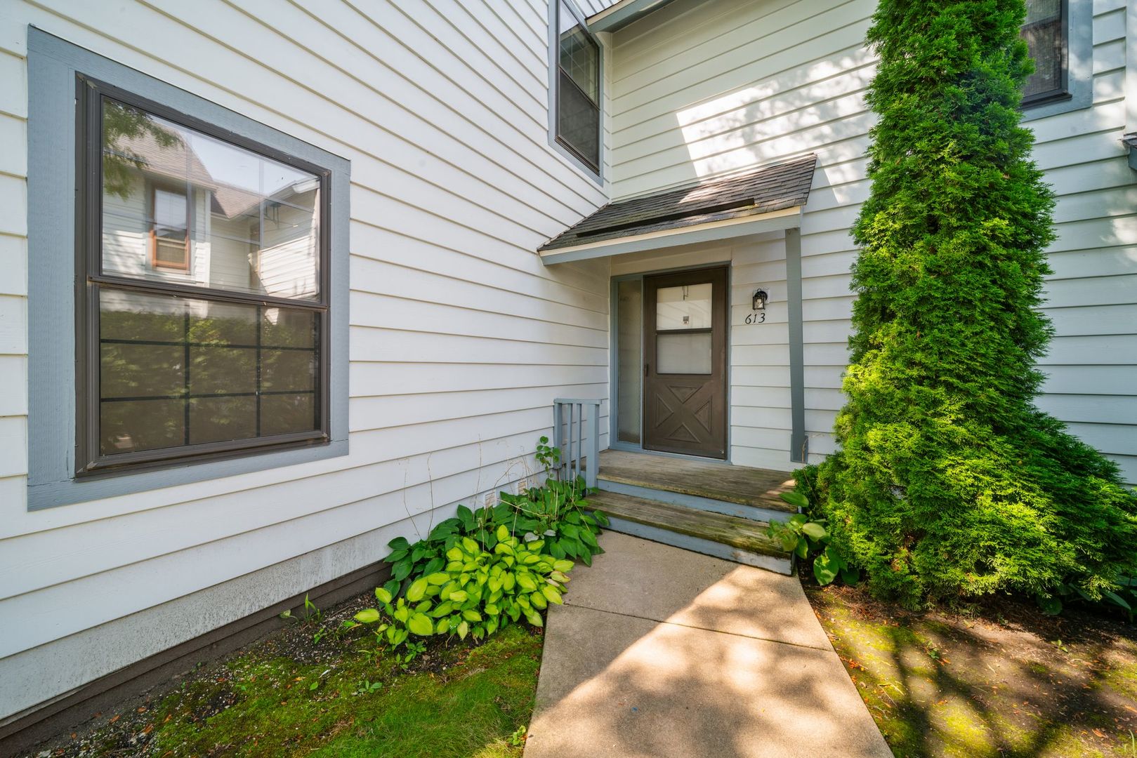 613 Dunham Road, Unit 613 Gurnee, IL 60031 - Photo 2 of 27 a view of a house with potted plants