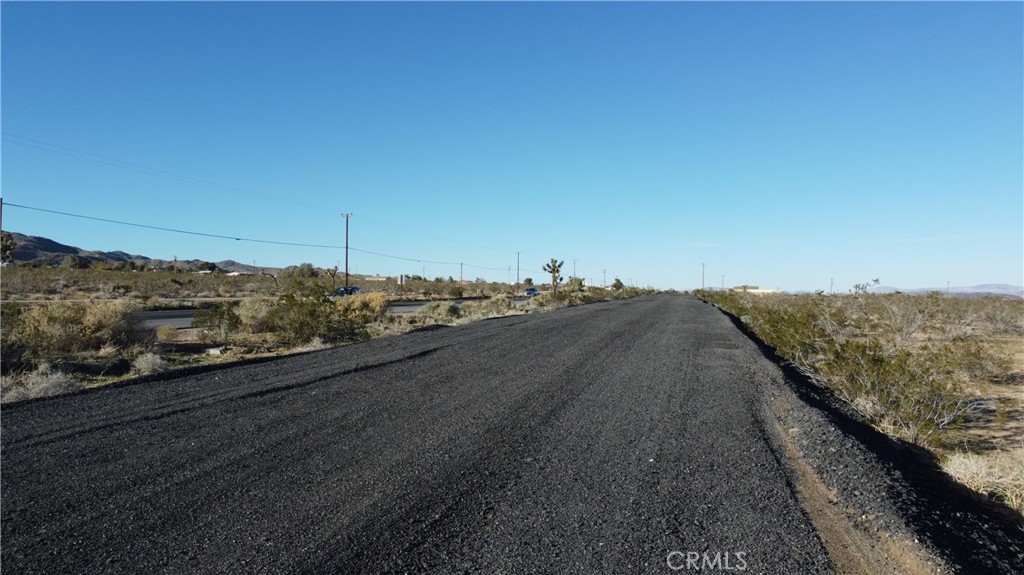 0 Old Woman Springs Road Yucca Valley, CA 92284 - Photo 8 of 10 a view of a city street from a terrace