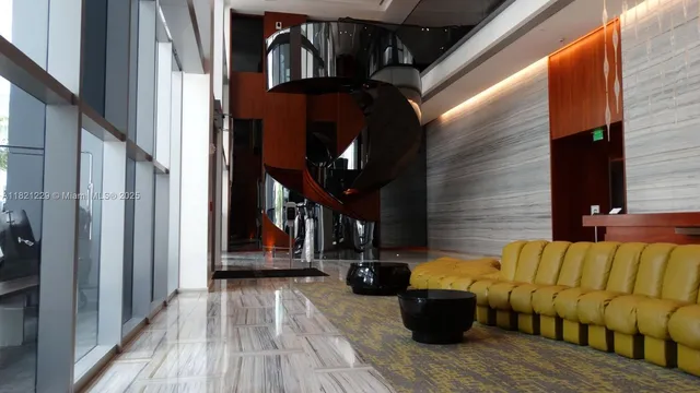 a view of a balcony with furniture and wooden floor