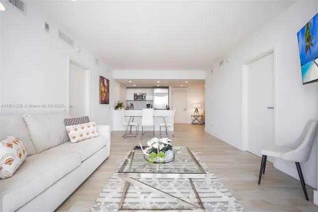 a living room with furniture and a table