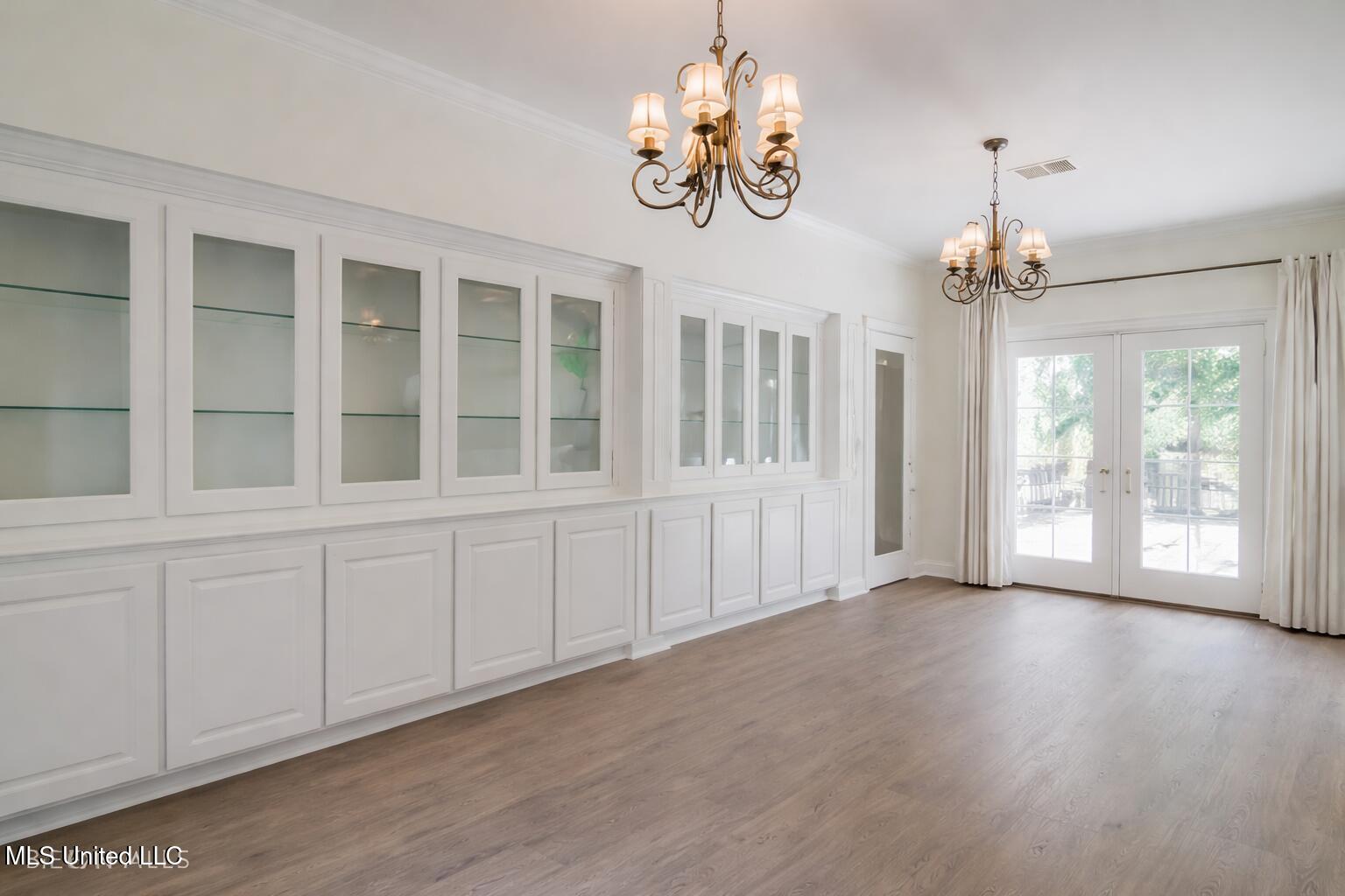 5029 Crescent Ridge Drive Kiln, MS 39556 - Photo 30 of 49 Elegant dining room with glass doors