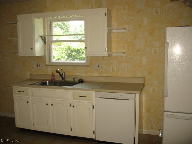 455 Broadview Road Tallmadge, OH 44278 - Photo 6 of 25 KITCHEN - SINK - FIXTURES - CF - ALL REPLACED - VIEW OVER SINK LOOKS ONTO BACK YARD
