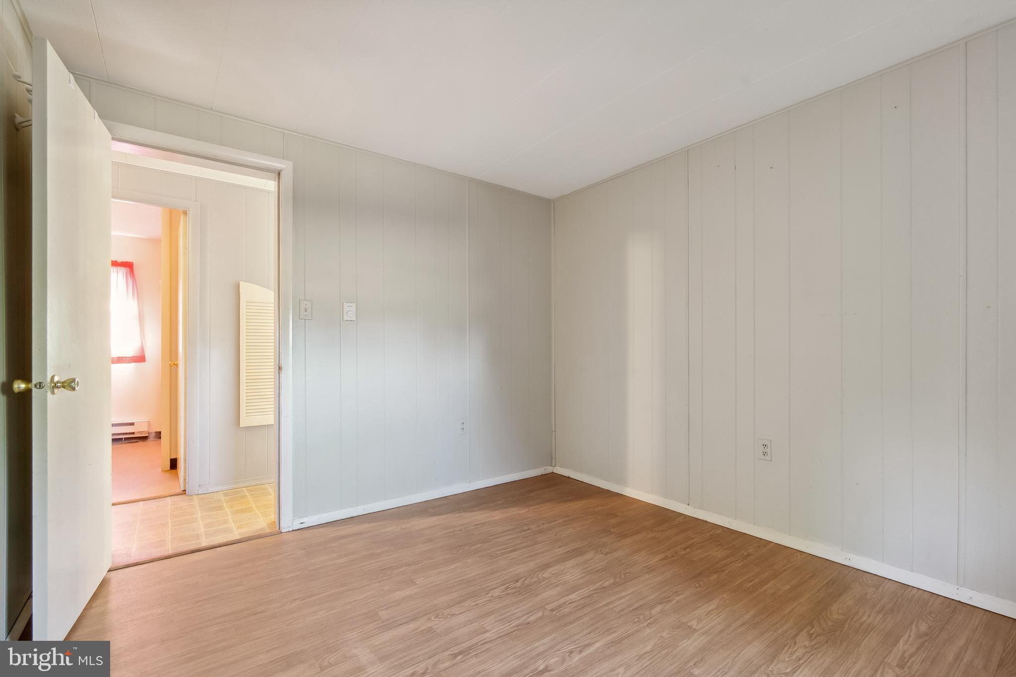1106 Round Top Road Chestertown, MD 21620 - Photo 12 of 27 wooden floor in an empty room