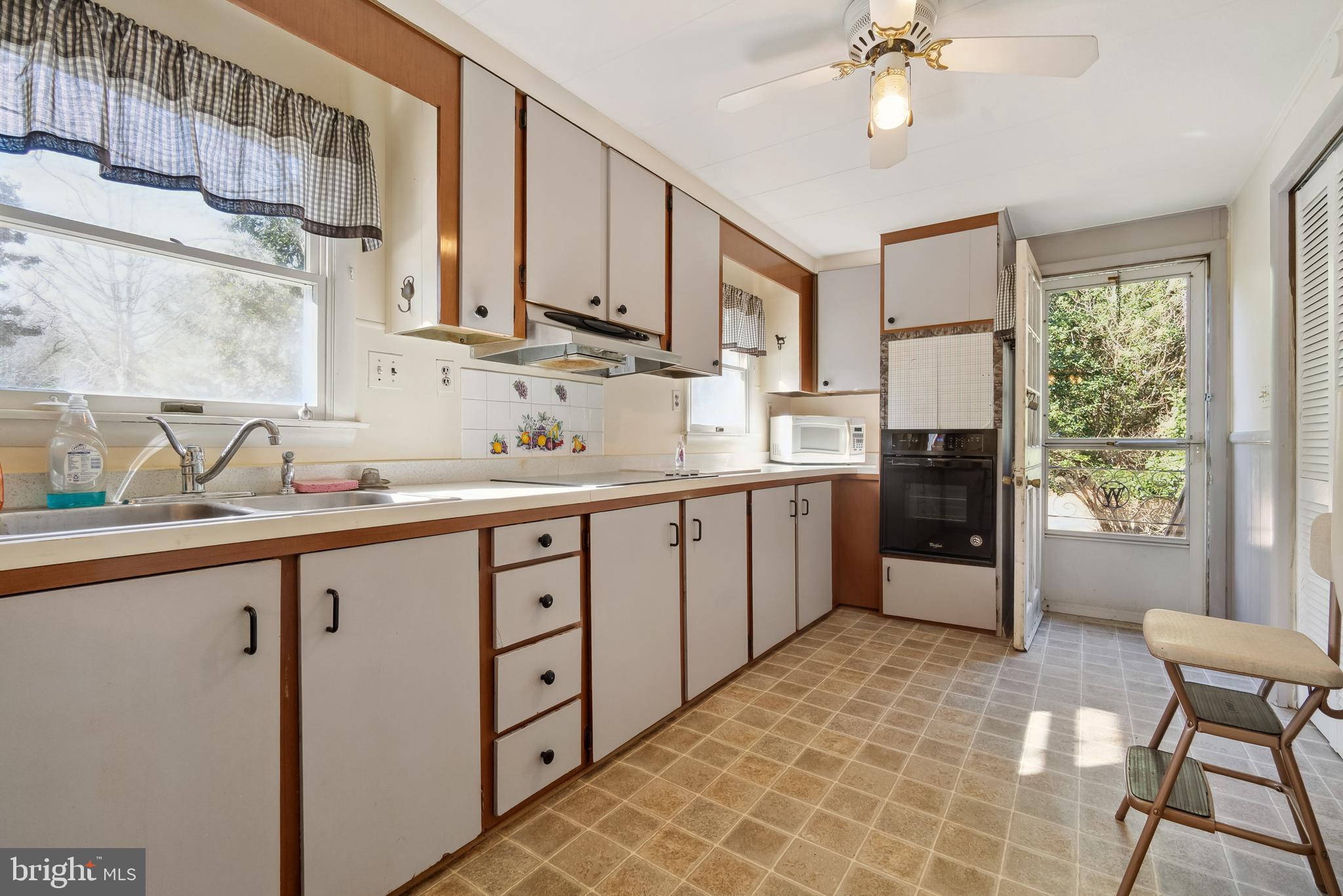 1106 Round Top Road Chestertown, MD 21620 - Photo 6 of 27 a kitchen with a sink cabinets and window