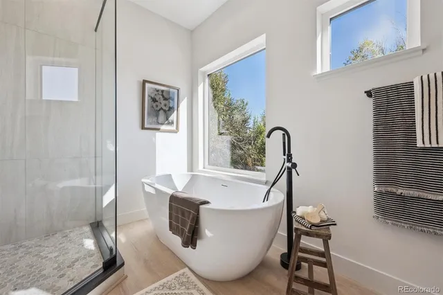 a bathroom with a bathtub and shower