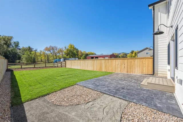 a view of backyard with outdoor space