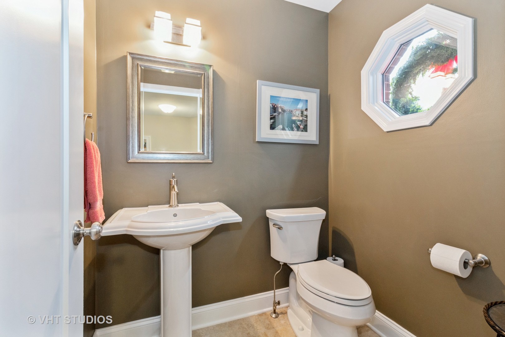 14520 Lake Ridge Road Orland Park, IL 60462 - Photo 14 of 16 a bathroom with a toilet sink and mirror
