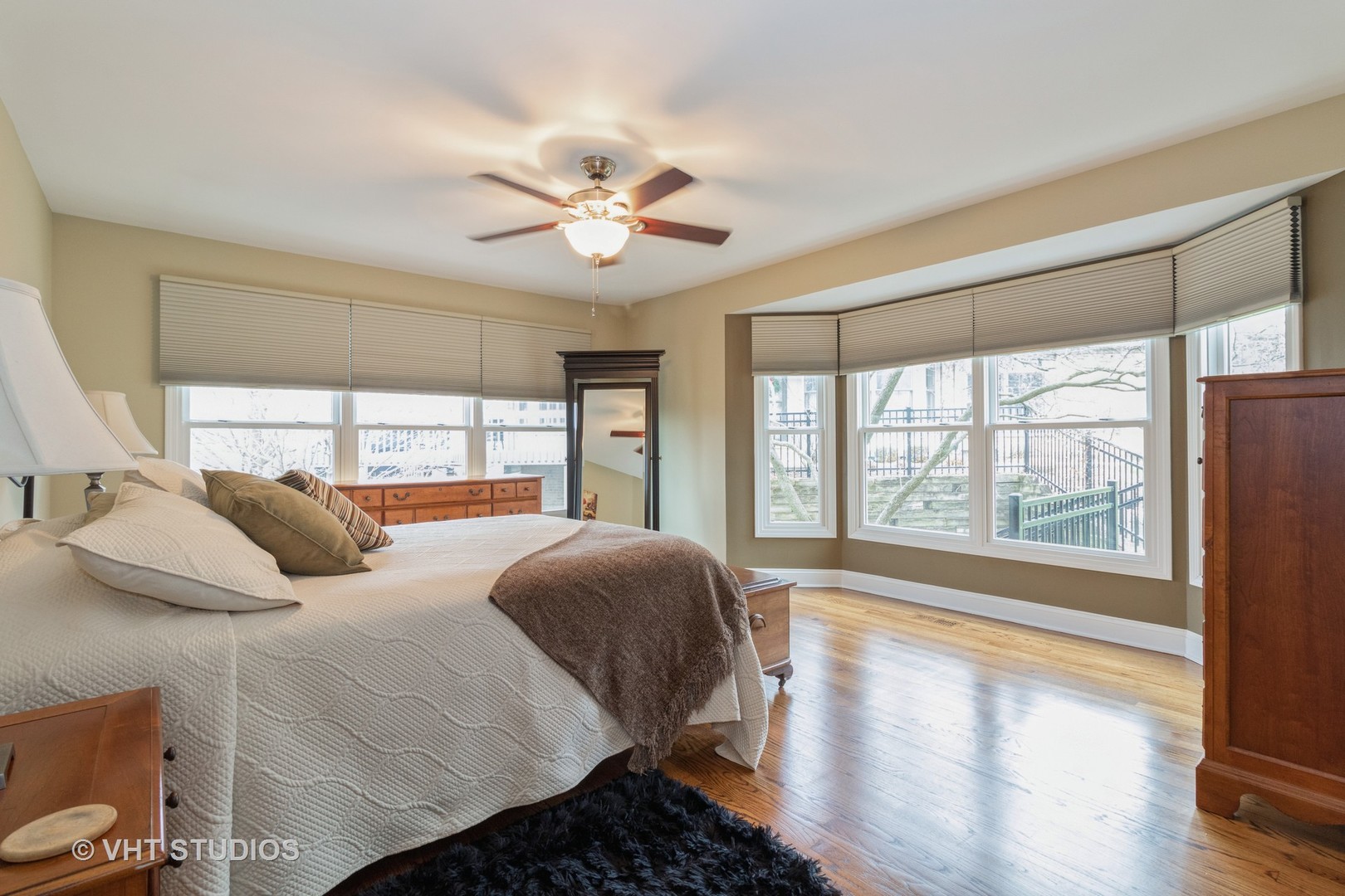 14520 Lake Ridge Road Orland Park, IL 60462 - Photo 10 of 16 a bedroom with a large bed and a large window