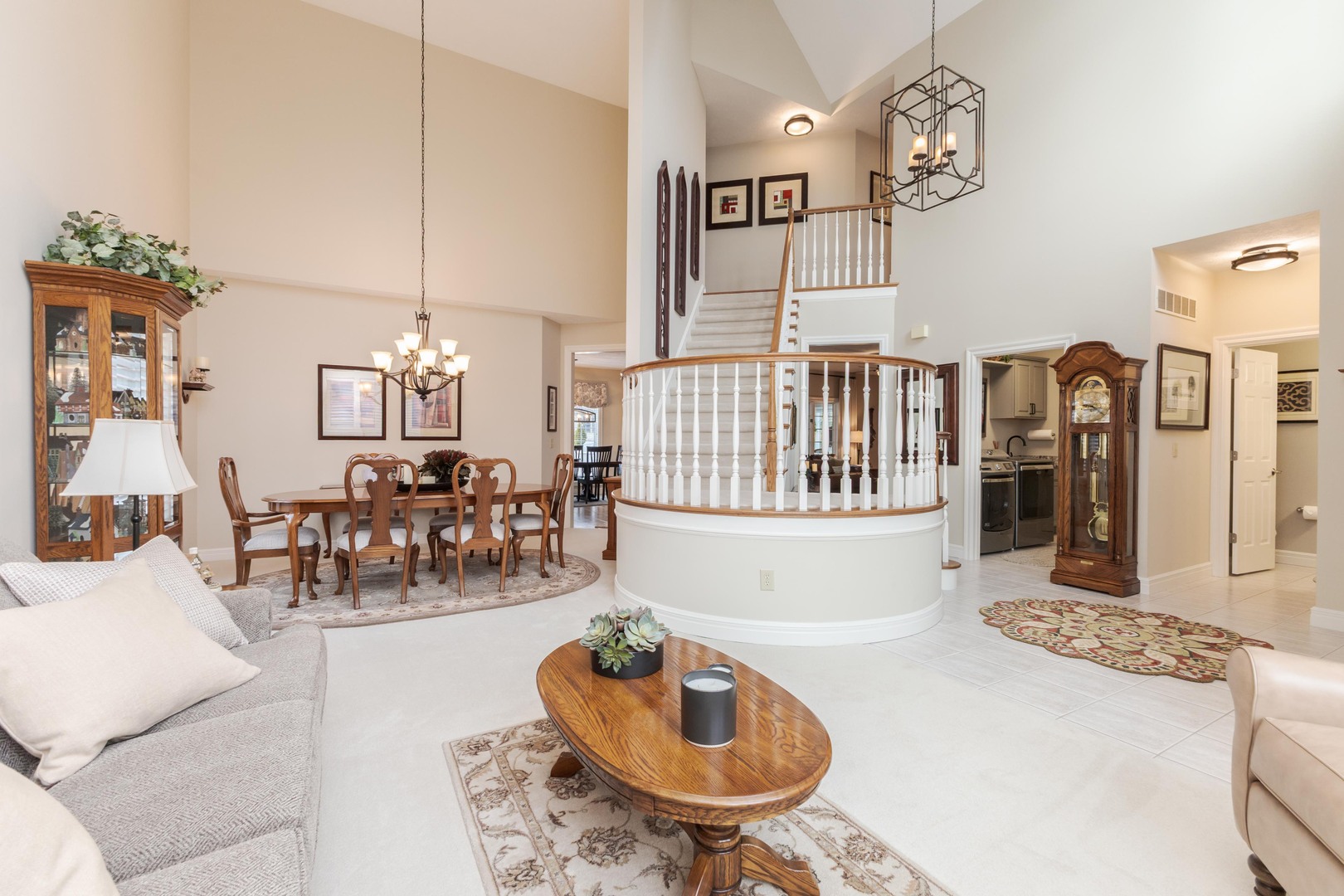 2006 Woodbine Road Bloomington, IL 61704 - Photo 27 of 98 a living room with furniture kitchen view and a chandelier