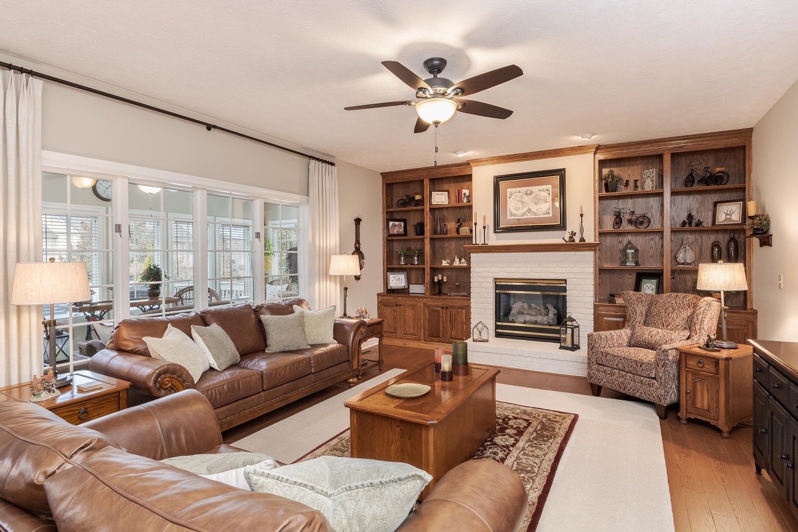 2006 Woodbine Road Bloomington, IL 61704 - Photo 32 of 98 a living room with furniture and a fireplace
